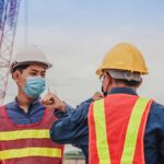 workers wearing mask on construction site